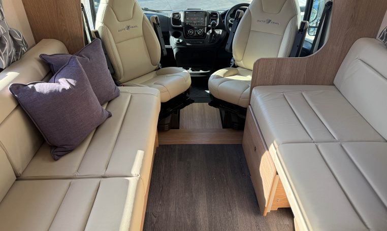 2024 Auto-Trail Frontier Comanche interior showcasing the cab swivel seats expanding the seating in the living room.