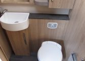 2024 Auto-Trail Frontier Comanche motorhome interior view showing the cabinet under the basin in the bathroom.