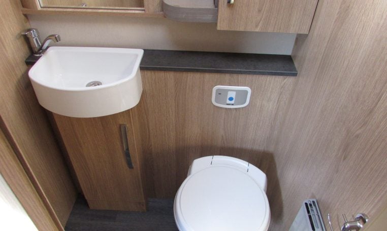 2024 Auto-Trail Frontier Comanche motorhome interior view showing the cabinet under the basin in the bathroom.