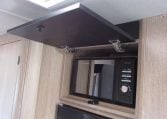 2024 Auto-Trail Frontier Comanche motorhome interior view showing the cover over the microwave open.