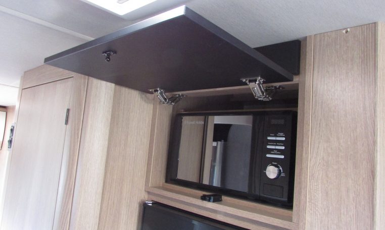2024 Auto-Trail Frontier Comanche motorhome interior view showing the cover over the microwave open.