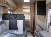 2024 Auto-Trail Frontier Comanche motorhome interior view showing the fabric seating in the front lounge.