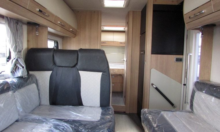2024 Auto-Trail Frontier Comanche motorhome interior view showing the fabric seating in the front lounge.