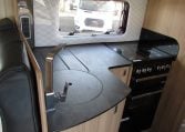 2024 Auto-Trail Frontier Comanche motorhome interior view showing the kitchen with hob and oven.