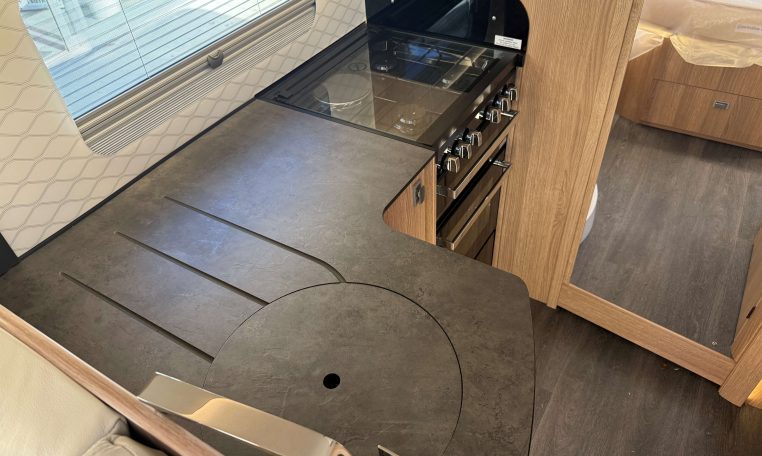 2024 Auto-Trail Frontier Comanche interior showing the ample working space on the kitchen bench.