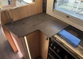 2024 Auto-Trail Frontier Comanche interior showcasing the cover over the kitchen sink.