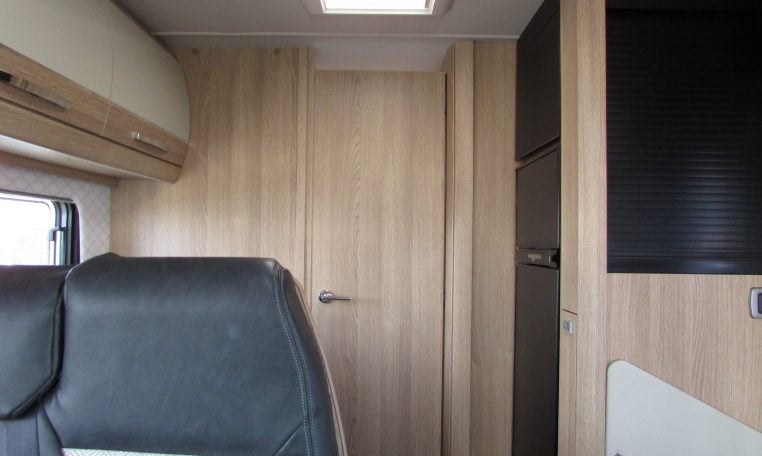 2024 Auto-Trail Frontier Comanche motorhome interior view showing the closed privacy bedroom door.
