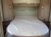 Auto-Trail Frontier Comanche motorhome interior with rear island bed and walk-around sleeping space.