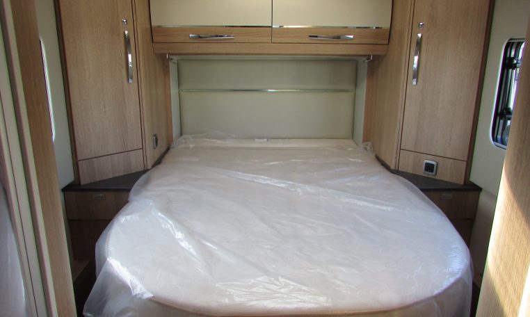 Auto-Trail Frontier Comanche motorhome interior with rear island bed and walk-around sleeping space.