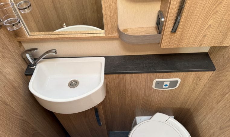 2024 Auto-Trail Frontier Comanche interior showing the toilet and handbasin setup.