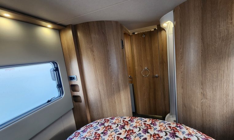 2024 Auto-Trail Frontier Delaware motorhome interior showing the bedroom door closed for privacy.