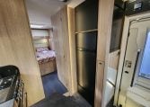 2024 Auto-Trail Frontier Delaware motorhome interior showing the fridge in the kitchen.