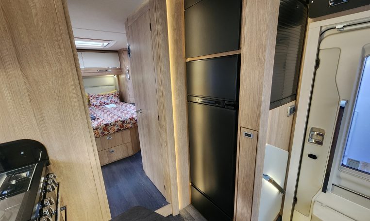 2024 Auto-Trail Frontier Delaware motorhome interior showing the fridge in the kitchen.