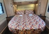 2024 Auto-Trail Frontier Delaware motorhome interior showing the rear island bed.