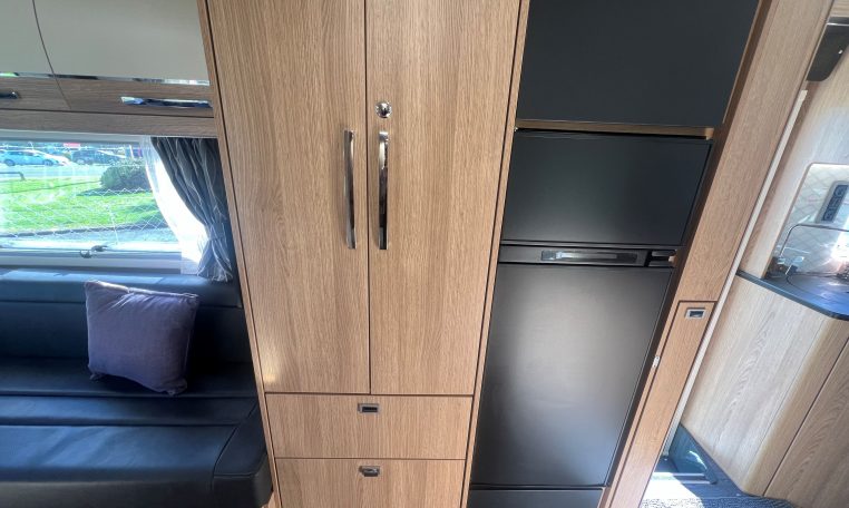 2024 Auto-Trail Frontier Scout interior view showing the wardrobe and fridge.