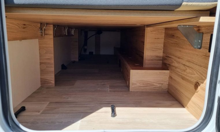 Fiat Ducato Pilote P696U exterior showing the extra storage compartment at the rear of the motorhome.