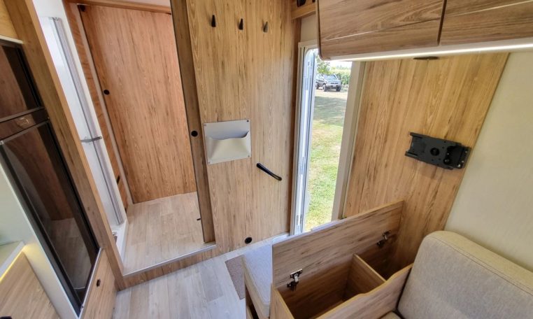Fiat Ducato Pilote P696U interior showing the extra storage compartment in the arm rest.