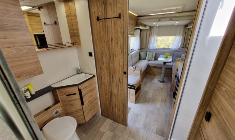 Fiat Ducato Pilote P696U interior showing the bathroom with handbasin.