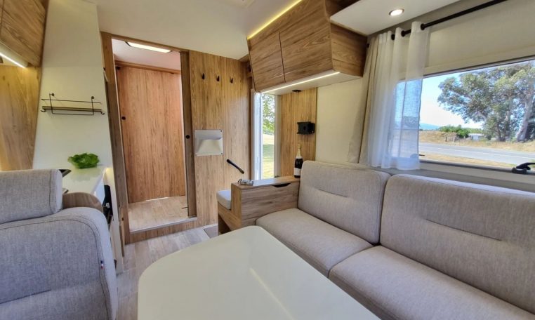 Fiat Ducato Pilote P696U interior showing the overhead storage in the rear lounge.