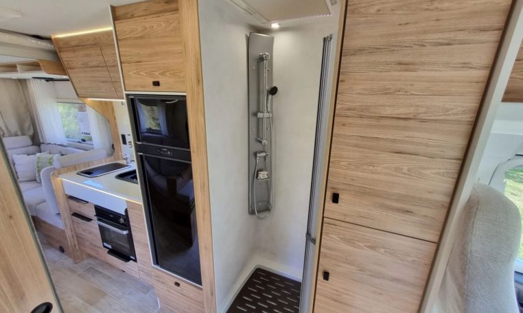 Fiat Ducato Pilote P696U interior showing the spacious separate shower.