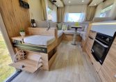 Fiat Ducato Pilote P696U interior showing the shoe storage at the motorhome entrance.