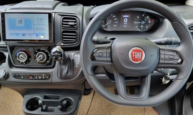 Fiat Ducato Pilote P696U interior showing the front cab with steering wheel and dashboard.