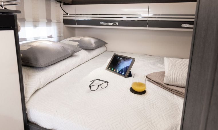 Rear Roller Team Zefiro 665 motorhome bed positioned above large garage provides elevated sleeping comfort, privacy and efficient space use max.