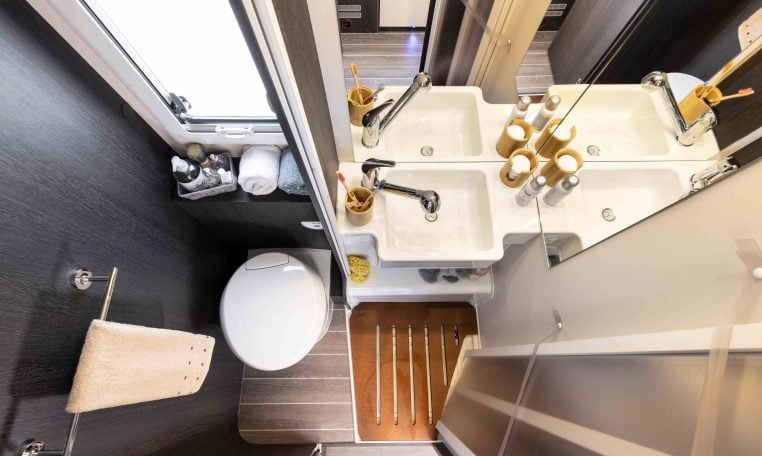Spacious separate shower inside the Roller Team Zefiro 665 motorhome, featuring modern fittings and bright lighting.
