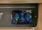 2025 Auto-Trail Comanche motorhome interior showing the control panel.