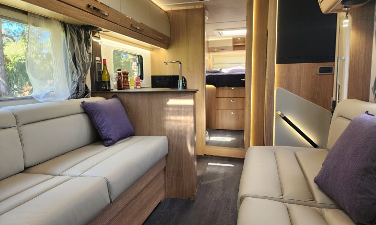 2025 Auto-Trail Comanche motorhome interior view of the front looking back.