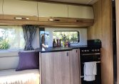 2025 Auto-Trail Comanche interior view of the motorhome compact kitchen.