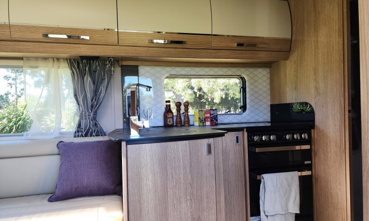 2025 Auto-Trail Comanche interior view of the motorhome compact kitchen.