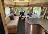 2025 Auto-Trail Comanche interior view of the motorhome kitchen and lounge.