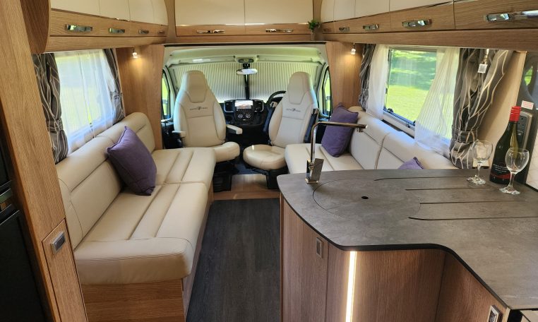 2025 Auto-Trail Comanche interior view of the motorhome kitchen and lounge.