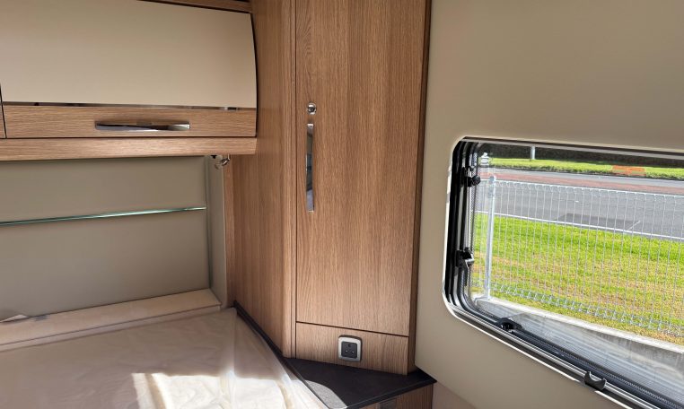 2025 Auto-Trail Frontier Comanche interior view of the side cupboard in the bedroom.