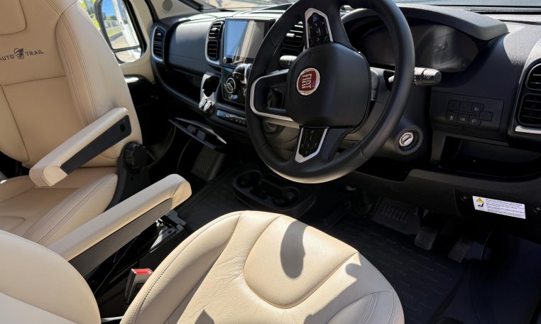2025 Auto-Trail Frontier Comanche interior view showing the steering wheel in the cab.