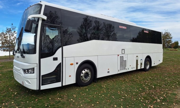Exterior view of a BCI Classmaster bus passenger entry door used for boarding and exiting.