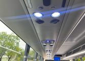 Overhead speakers in a BCI Classmaster bus providing audio announcements and entertainment for passengers.