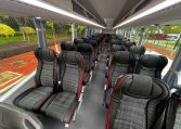 Passenger seats inside a BCI Classmaster bus arranged in rows along the aisle.