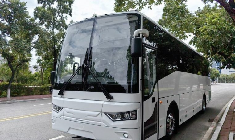 Exterior view of a BCI Cruiser bus passenger entry door used for boarding and exiting.