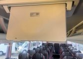 Passenger seats inside a BCI Cruiser bus arranged in rows along the aisle.