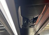 Overhead lights in a BCI Volvo B13R bus providing illumination for passengers.