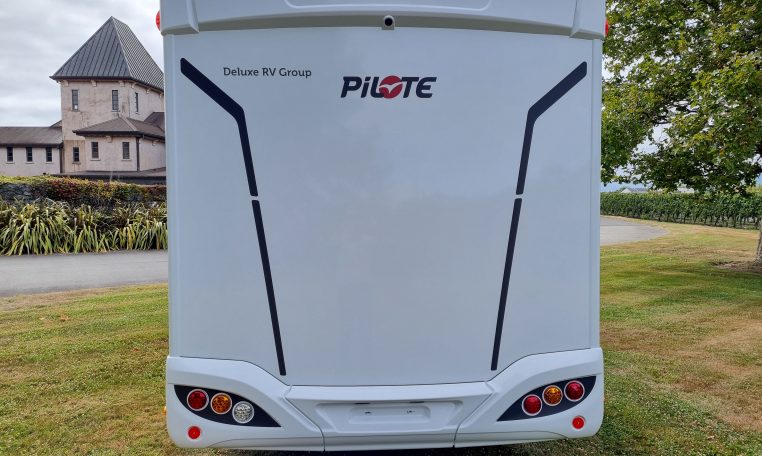 2025 Fiat Ducato Pilote P650C motorhome exterior view showing the rear side.