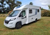 Exterior front and passenger side view of a Fiat Ducato Pilote P650C motorhome showing cab, headlights, side profile, and exterior design.