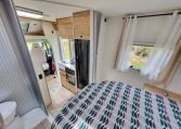 2025 Fiat Ducato Pilote P650C motorhome interior view showing the bedroom fabric curtains.