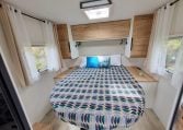 2025 Fiat Ducato Pilote P650C motorhome interior view showing the bedroom skylight letting in natural light.