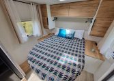 2025 Fiat Ducato Pilote P650C motorhome interior view showing the bedroom window letting in natural light.