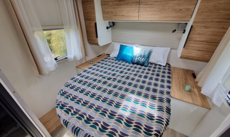 2025 Fiat Ducato Pilote P650C motorhome interior view showing the bedroom window letting in natural light.
