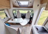2025 Fiat Ducato Pilote P650C motorhome interior view showing the cab swivel chairs.