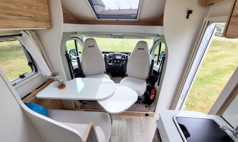 2025 Fiat Ducato Pilote P650C motorhome interior view showing the cab swivel chairs.